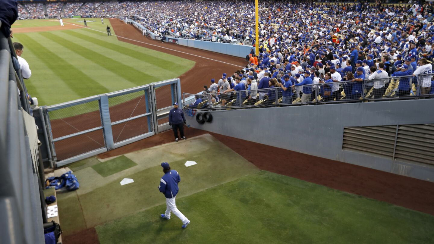 Dodgers pitcher Clayton Kershaw walks to the bullpen at the start of Game 6.