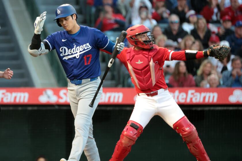 ANAHEIM, CALIFORNIA - MARCH 26: Dodgers Shohei Ohtani strikes out in the fourth inning.