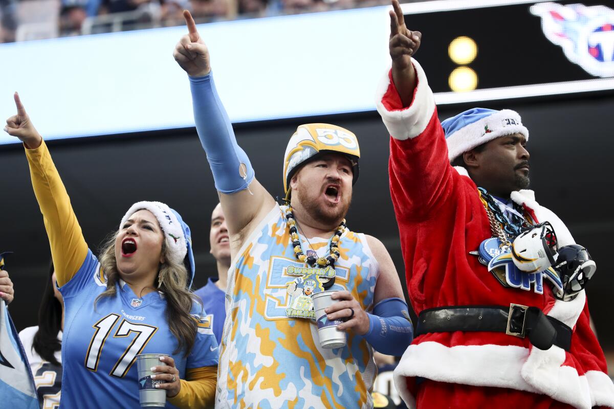  Chargers fans cheer during a 17-14 victory over the Tennessee Titans.