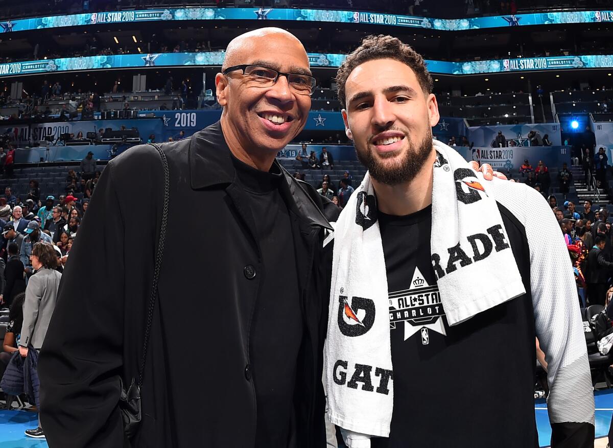 Mychal Thompson, left, and son Klay Thompson pose at the 2019 NBA All-Star Game