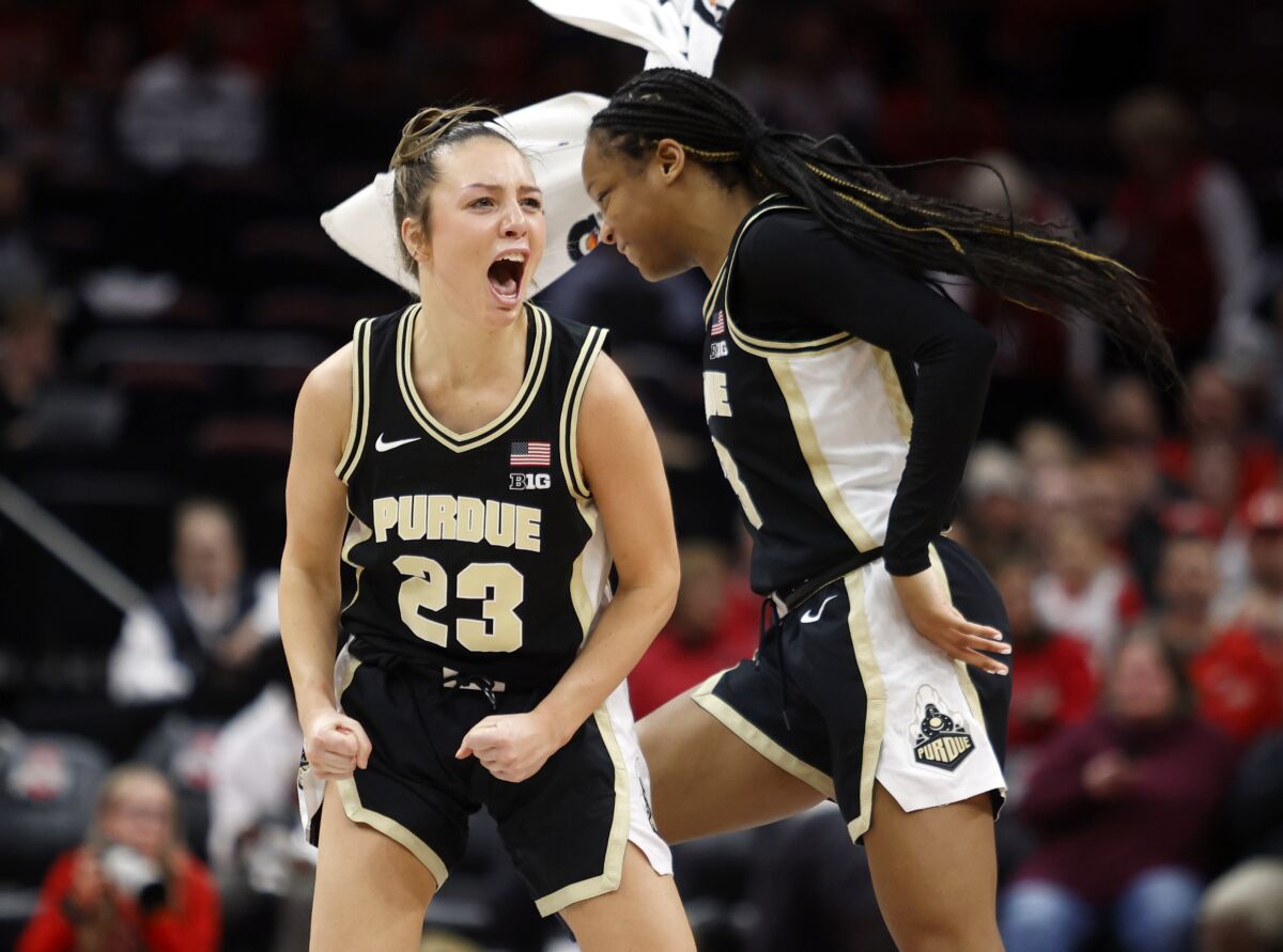 Purdue guard Abbey Ellis, left, and teammate guard Jayla Smith celebrate following their 73-65 NCAA college basketball game win over Ohio State in Columbus, Ohio, Sunday, Jan. 29, 2023. (AP Photo/Paul Vernon)