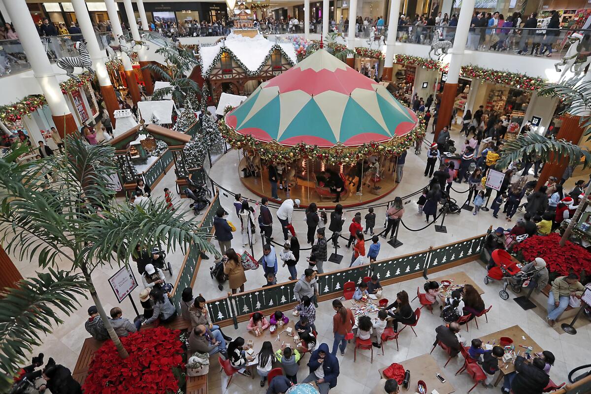 Shoppers fill South Coast Plaza's Carousel Court.