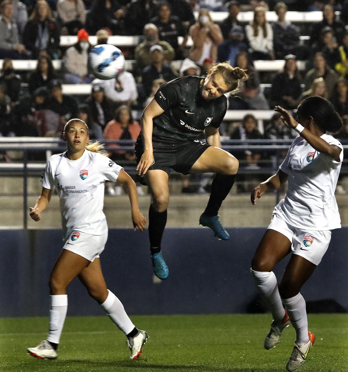 Angel City's Savannah McCaskill jumps into the air to score the first goal in franchise history.