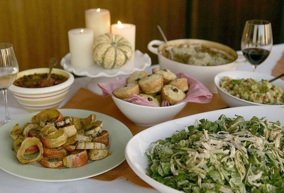 From left, roasted squash, pepper relish, cornmeal-apricot muffins, quick cassoulet, Brussels sprouts with pancetta, and Asian turkey salad.