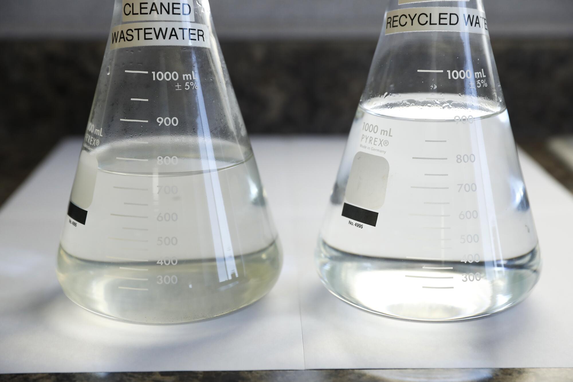 A cleaned wastewater sample, left, and a purified recycled water sample, right.