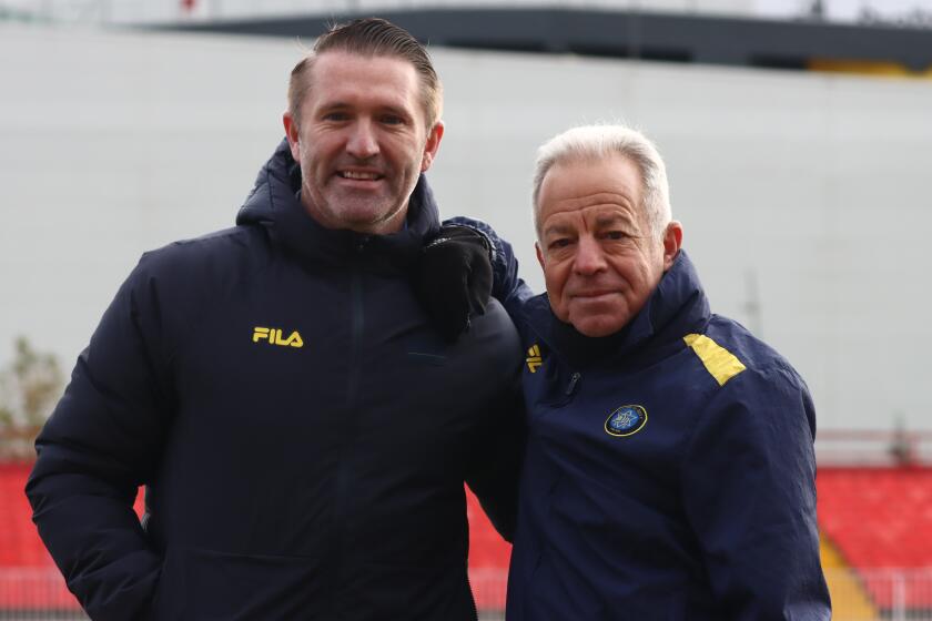 Former Galaxy star Robbie Keane, left, and former U.S. men's national team assistant Dave Sarachan.