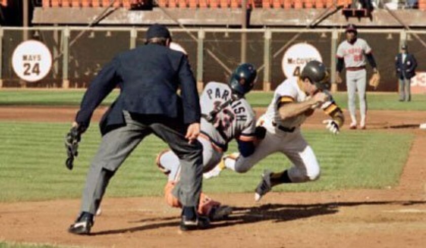 The Padres' Steve Garvey scores the first run of the 1984 All-Star Game at Candlestick Park after colliding with Tigers catcher Lance Parrish.