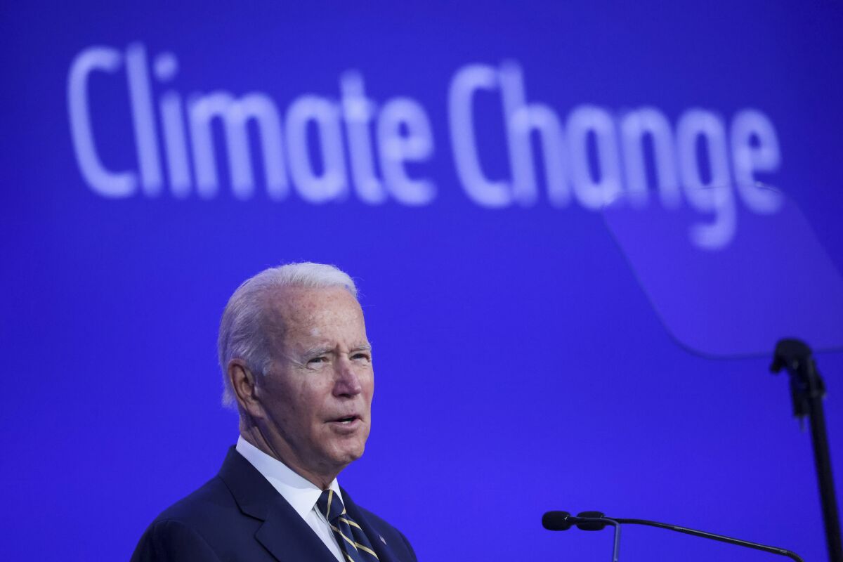 U.S. President Joe Biden speaks during the opening ceremony of the UN Climate Change Conference COP26 in Glasgow, Scotland, Monday Nov. 1, 2021. The U.N. climate summit in Glasgow gathers leaders from around the world, in Scotland's biggest city, to lay out their vision for addressing the common challenge of global warming. (Yves Herman/Pool via AP)
