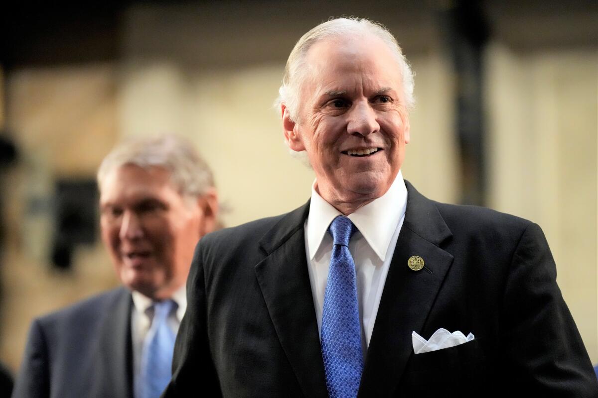 FILE - South Carolina Gov. Henry McMaster greets lawmakers ahead of his State of the State address on Wednesday, Jan. 19, 2022, in Columbia, S.C. Democrats in South Carolina get another shot at loosening the firm grasp Republican have on statewide politics as voting ends Tuesday for the 2022 elections. But it's likely to be a tough fight.(AP Photo/Meg Kinnard, File)