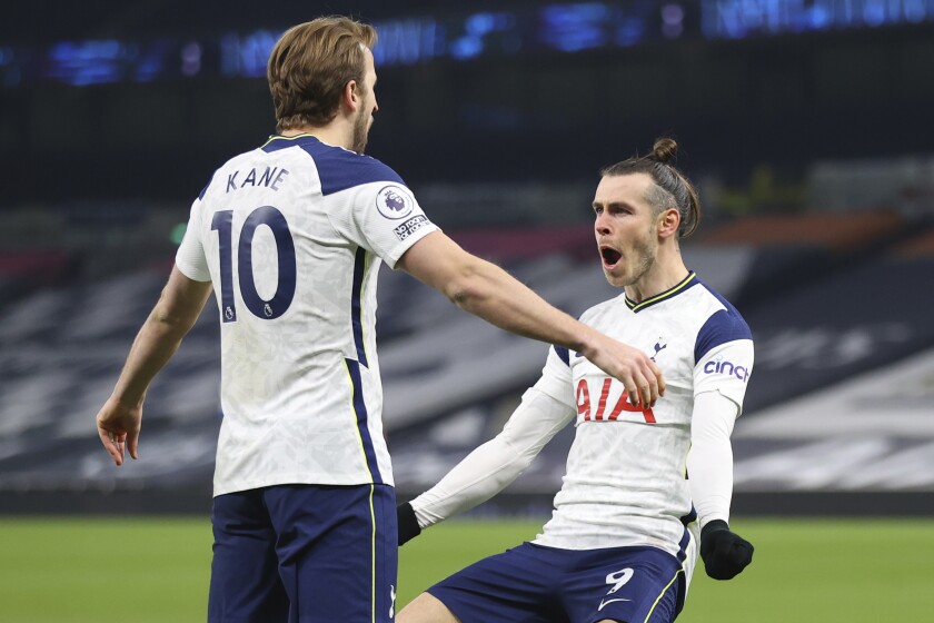 Tottenham's Gareth Bale, right, celebrates after scoring his side's second goal with Tottenham's Harry Kane during the English Premier League soccer match between Tottenham Hotspur and Crystal Palace at the Tottenham Hotspur Stadium in London, Sunday, March 7, 2021. (Julian Finney/Pool via AP)
