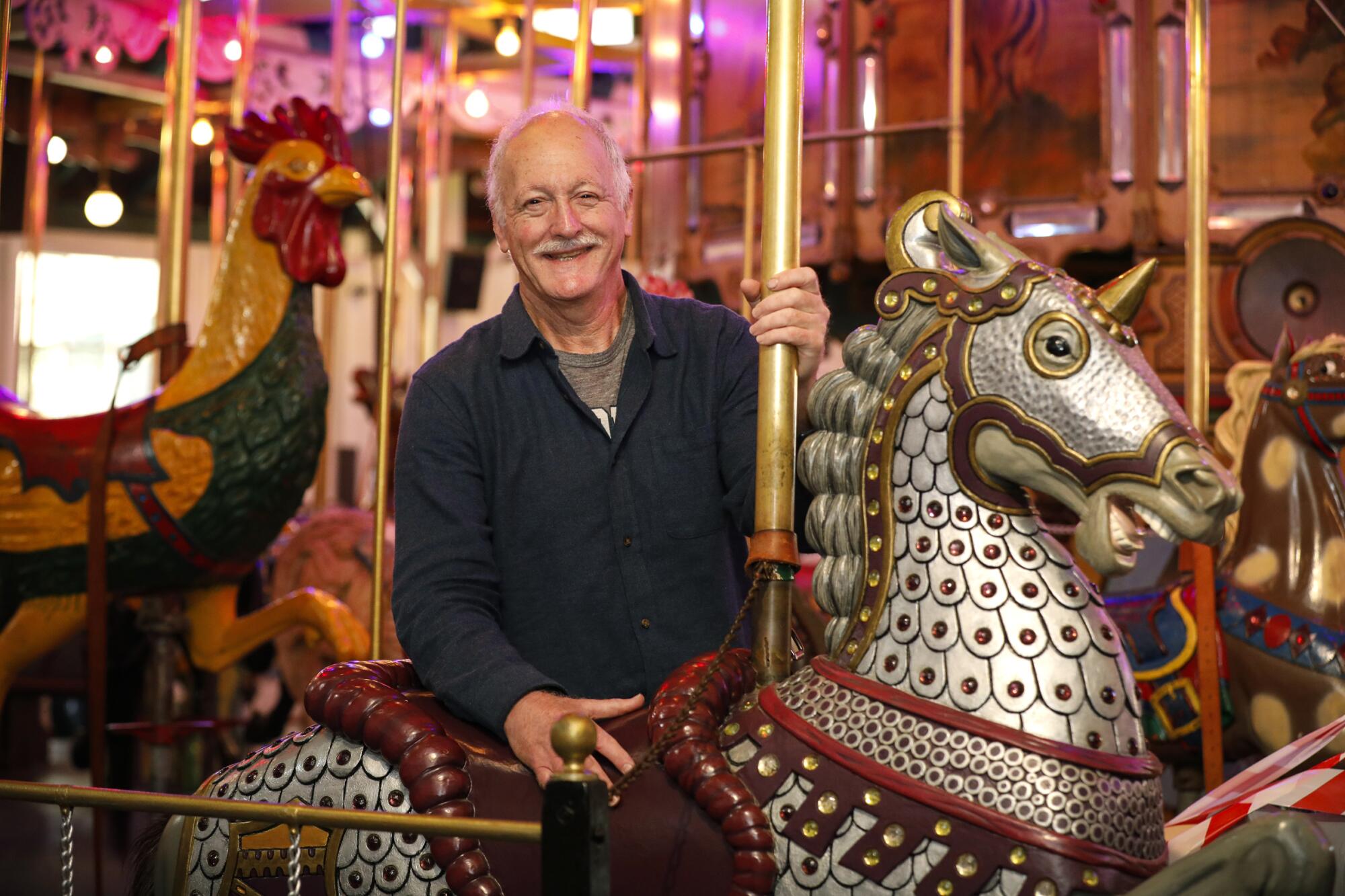 Bill Brown poses with a more recently restored horse.