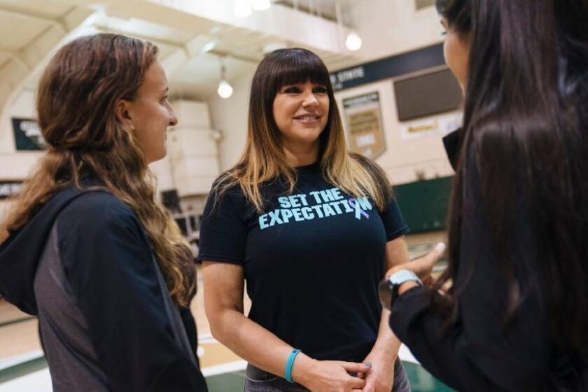 Sacramento State Track and Field athletes, Emma Armstrong and Amy Quionones thank Brenda Tracy for talking to the student athletes at Sacramento State in Sacramento, Calif. Wednesday, Oct. 17, 2018. Tracy travels the nation speaking to college and high school athletes about sexual assault and toxic masculinity. (Mason Trinca for The Los Angeles Times)
