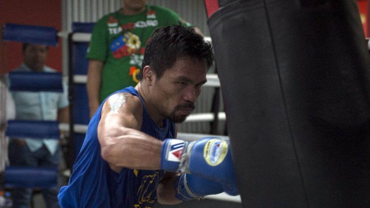 Manny Pacquiao trains in Manila last year. Promoter Bob Arum says Pacquiao will fight twice this year.