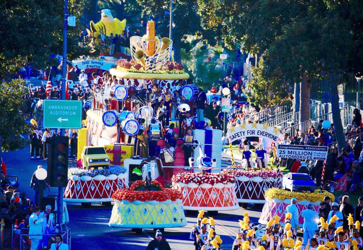 Floats queue up on Orange Grove Boulevard for the start of the 2019 Rose Parade in Pasadena.