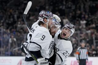 Los Angeles Kings defenseman Drew Doughty, center, celebrates his goal against the Anaheim Ducks.