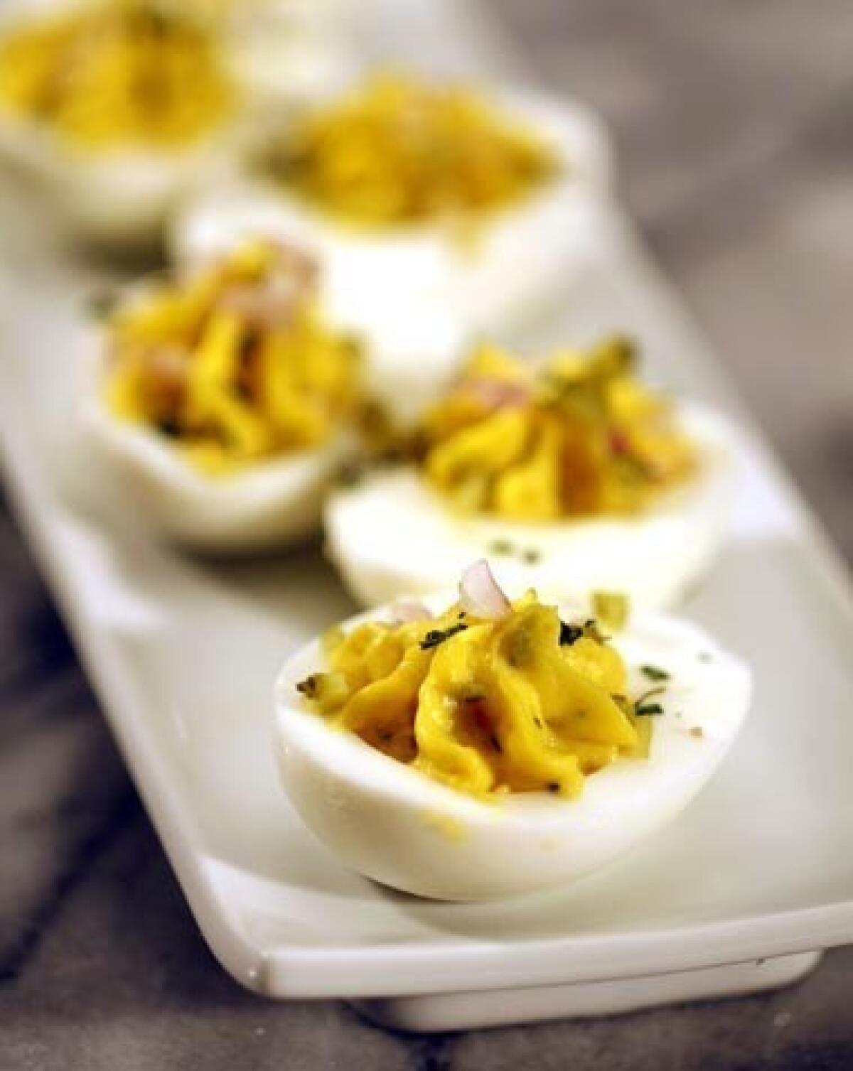 Deviled eggs with tarragon and cornichons is a kind of inside-out variation on sauce gribiche.