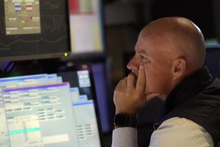 Specialist John O'Hara works at his post on the floor of the New York Stock Exchange, Wednesday, Aug. 7, 2024. (AP Photo/Richard Drew)