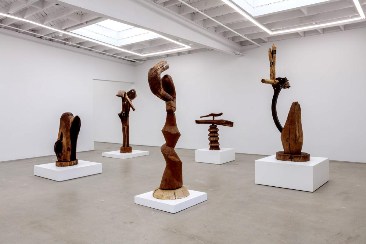 Sculptures spaced apart in a gallery.