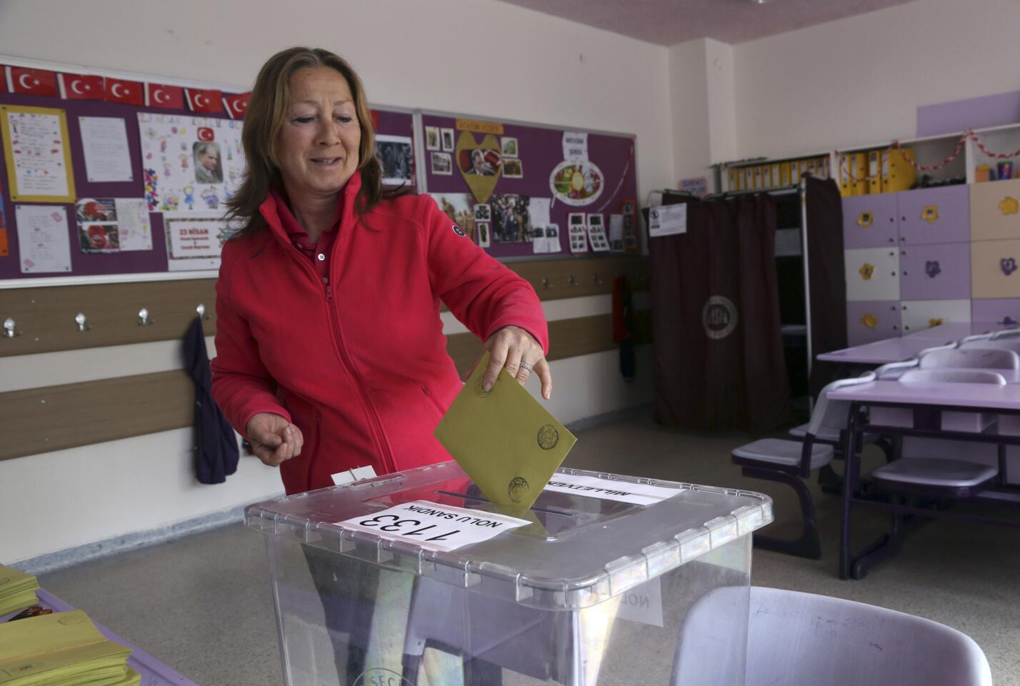A Turkish woman casts her vote at a polling station in an Ankara primary school on June 7.