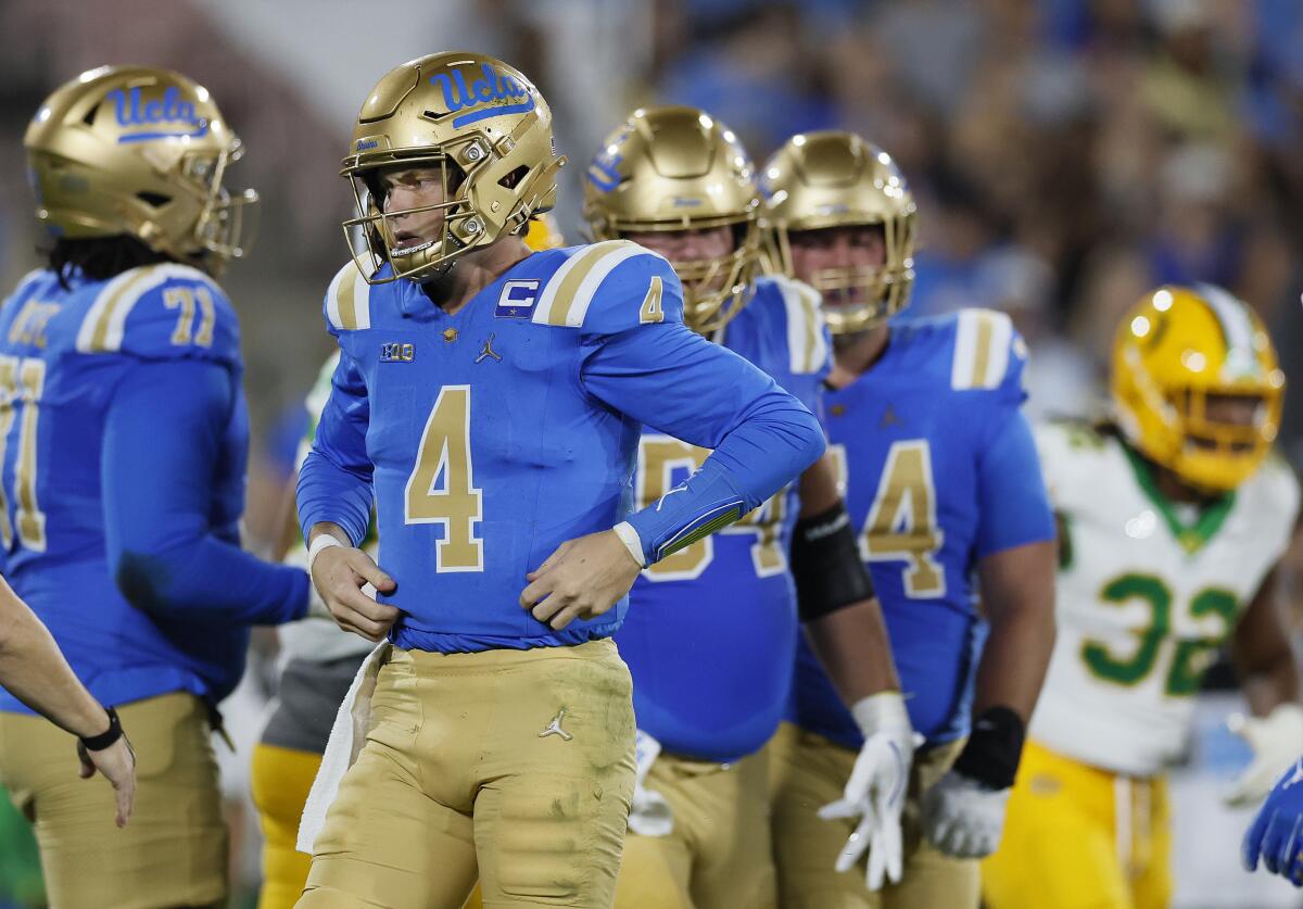 UCLA quarterback Ethan Garbers stands on the field during a loss to Oregon at Rose Bowl.