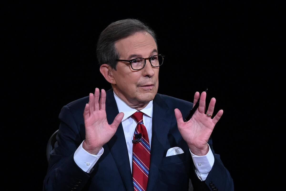 Moderator Chris Wallace moderates the debate.