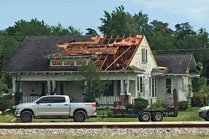 A roof is torn off a home following a suspected tornado, Saturday, April 13, 2019 in Franklin, Texas. (Laura McKenzie/College Station Eagle via AP)