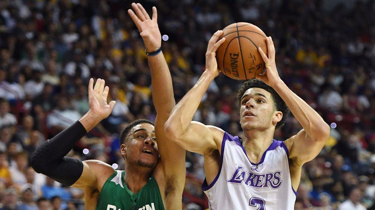 Lakers' Lonzo Ball, right, drives to the basket against Boston Celtics' Landen Lucas during the 2017 Summer League on Saturday in Las Vegas.