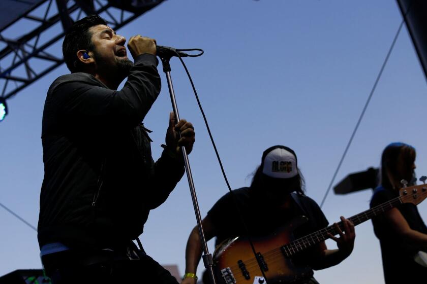 WEST HOLLYWOOD, CALIFORNIA-SEPTEMBER 20, 2014: The 2014 Sunset Strip Music Festival brought acts like Jane's Addiction and Failure to the famed boulevard that runs through West Hollywood. Deftones lead singer Chino Moreno, left, performs with Crosses, a musical side project formed with guitarist Shaun Lopez. (Michael Robinson Chavez/Los Angeles Times)