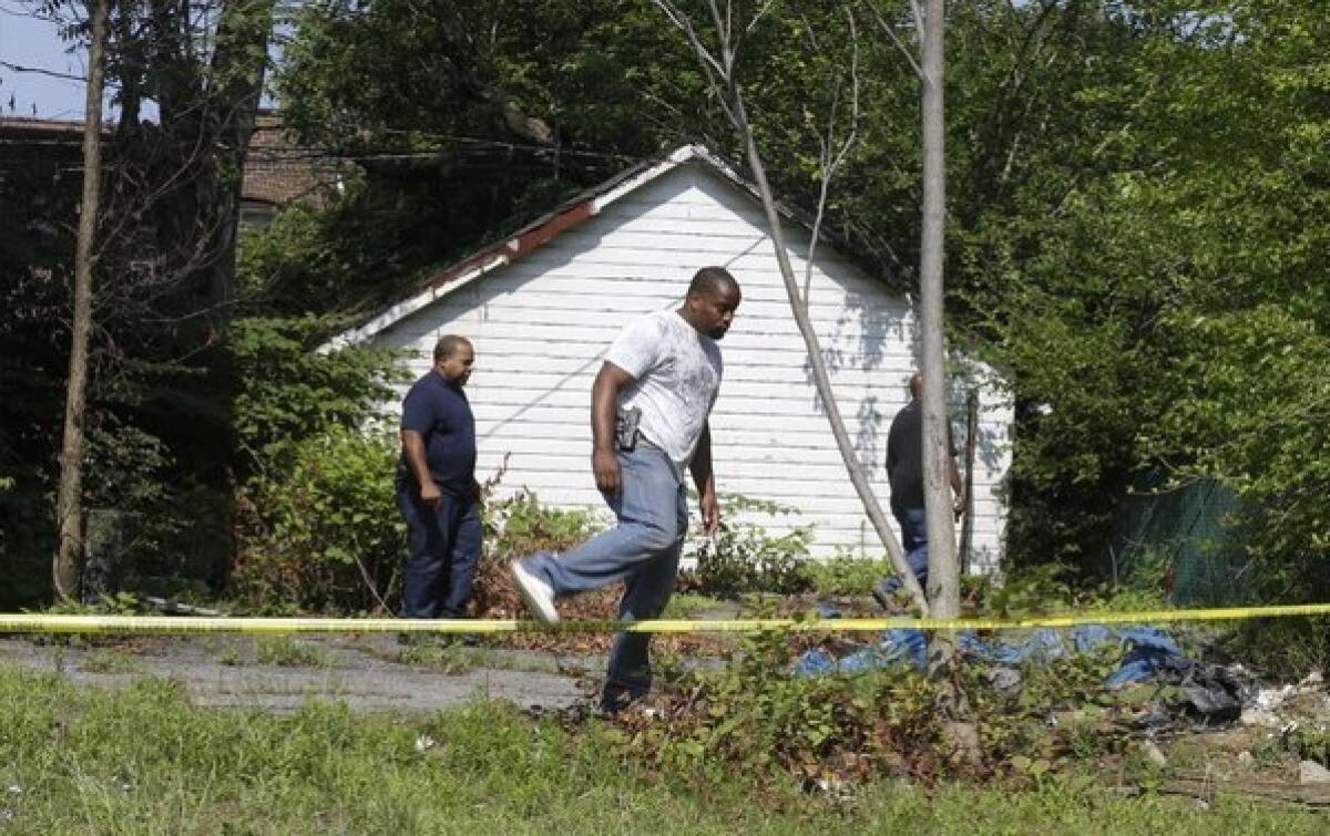 East Cleveland police conduct a search after three bodies were found wrapped in garbage bags. A suspect is in custody and is expected to face charges.