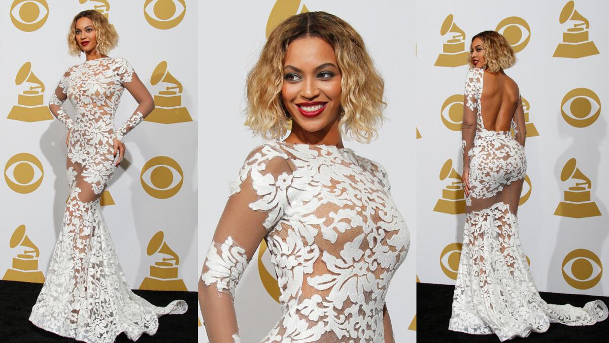Beyonce probably deserves her own hall of fame category for head-turning Grammy looks like this sheer, white floral lace gown by Michael Costello that she wore at the 2014 awards.