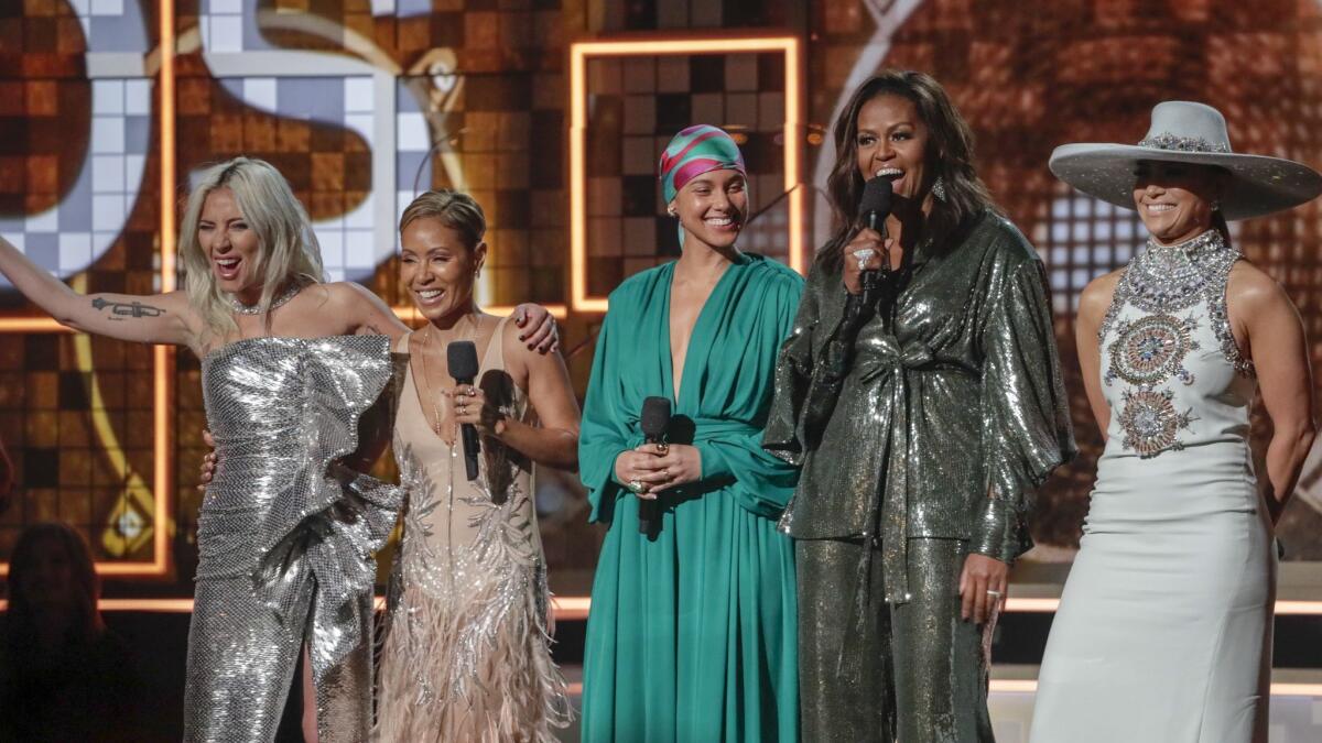 From left to right, Lady Gaga, Jada Pinkett Smith, host Alicia Keys, Michelle Obama and Jennifer Lopez onstage at the 61st Grammy Awards.