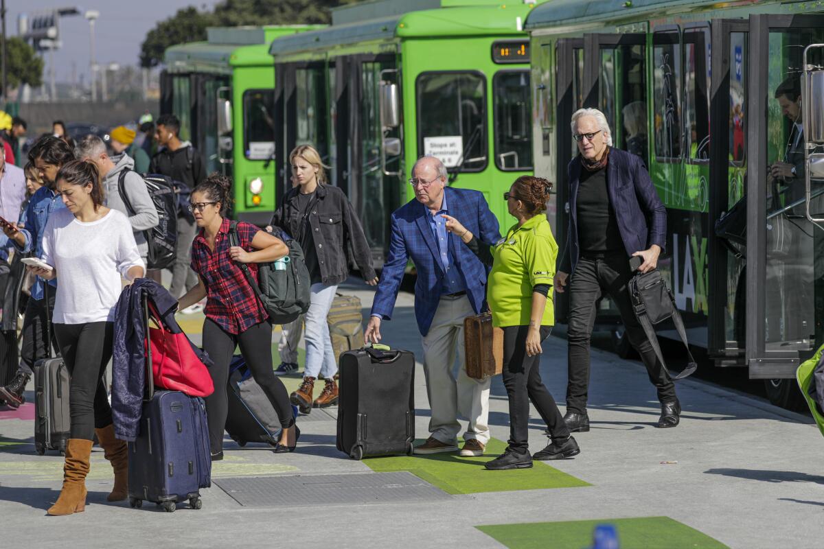 Passengers arrive at the "LAXit" lot