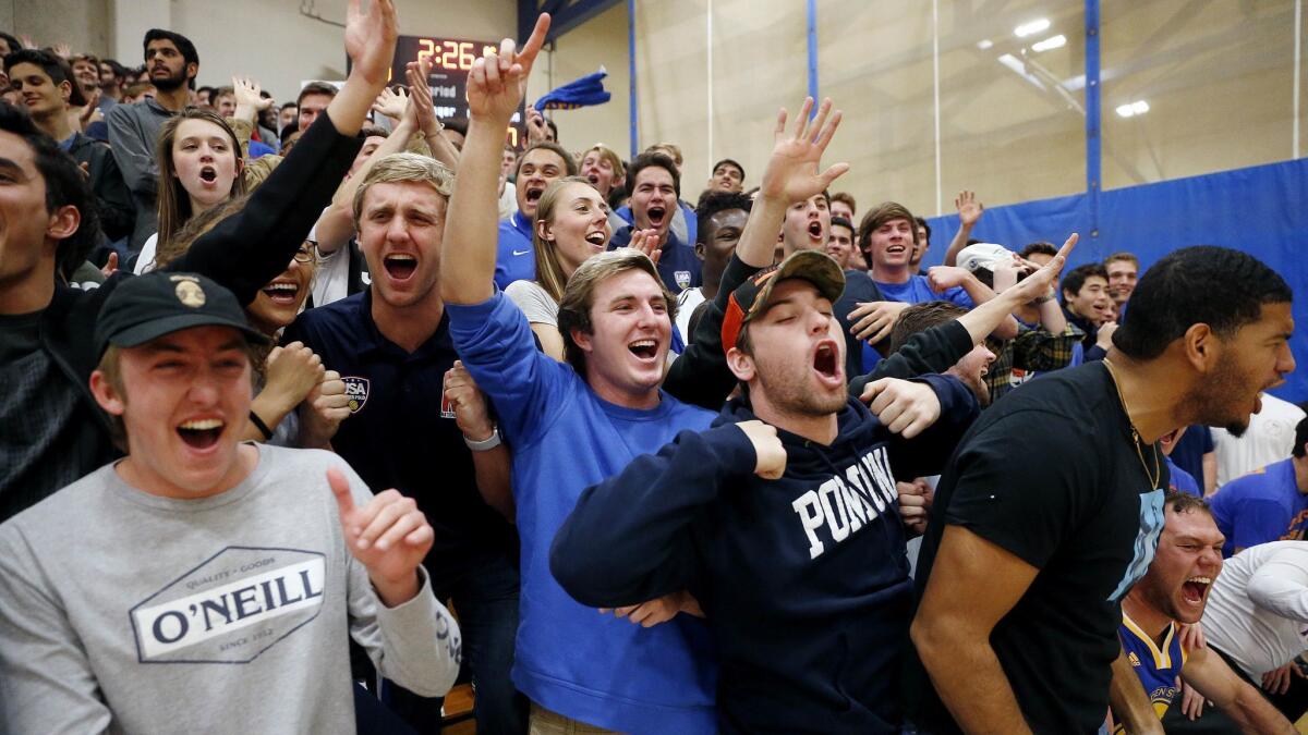 Fans in the Pomona-Pitzer student section react during the Sagehens' game against Occidental on Feb. 23.