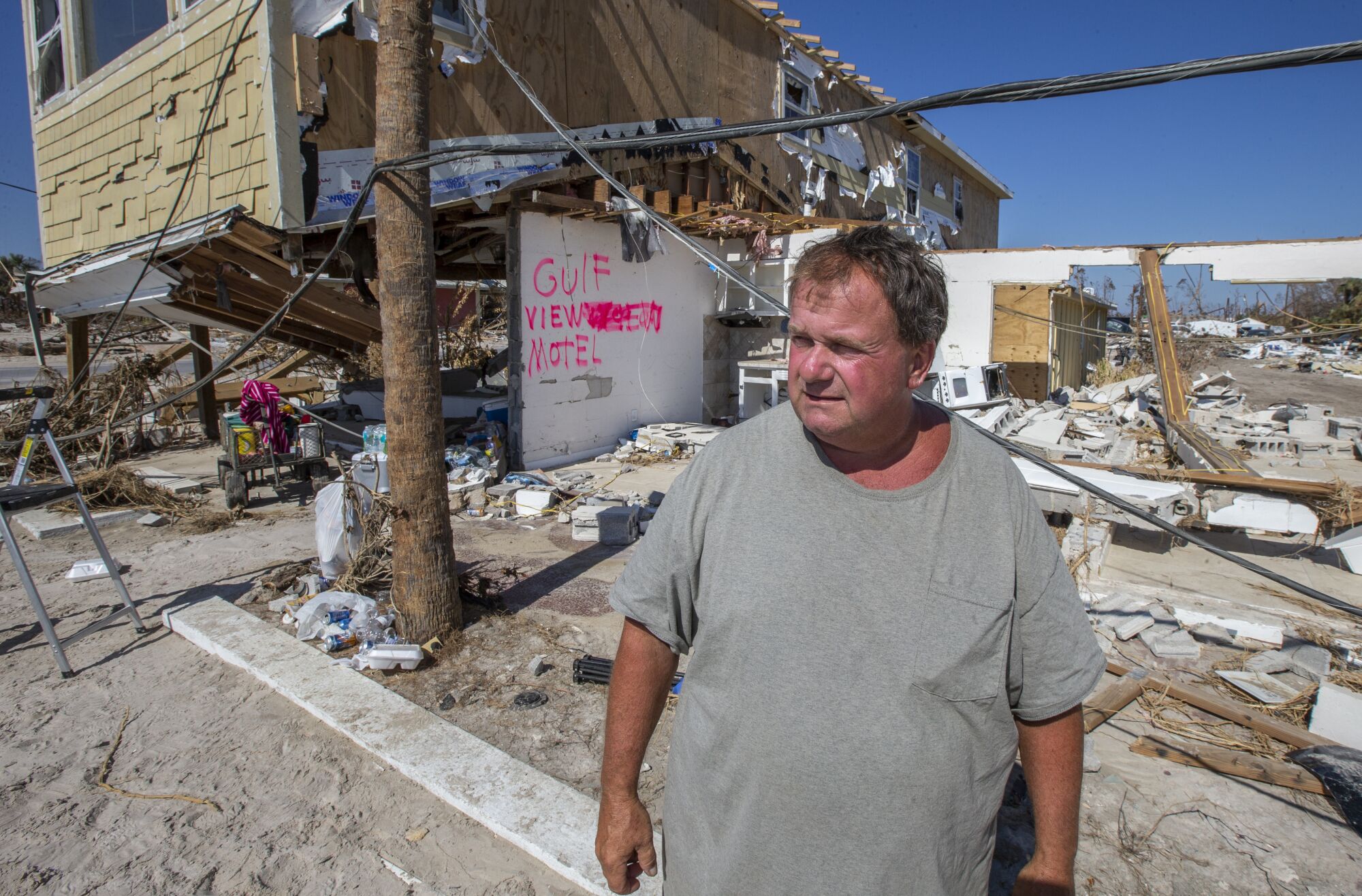 Charles Smith stands in front of what used to be his Gulf View Motel in 2018.