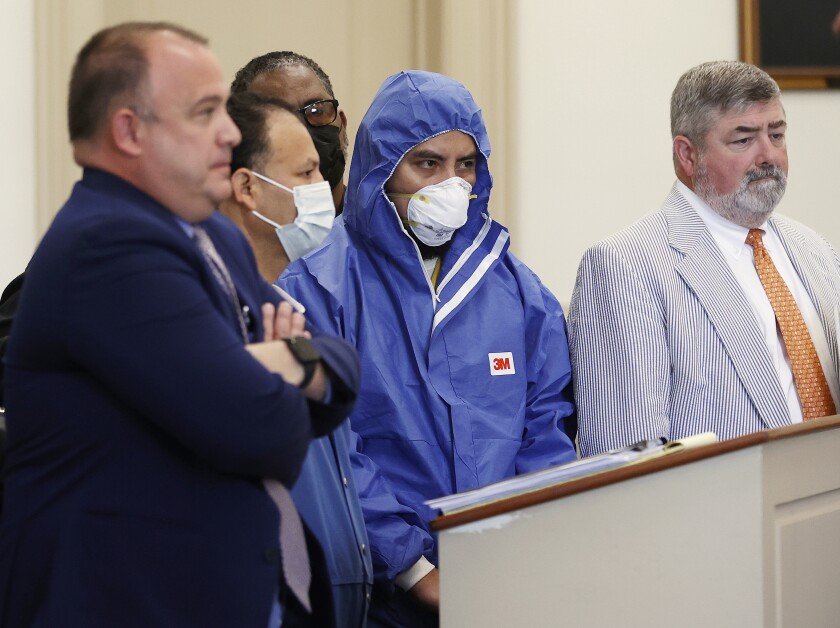 Julio Cesar Alvarado-Dubon, middle left to right, and Rolman Balcarcel-Bavagas, both charged with felony possession of a firearm by an illegal alien, stand with defense attorneys Jose Aponte, left, and Samuel Simpson V during a preliminary hearing before Judge David M. Hicks in Richmond City General District Court in Richmond, Va., Wednesday, Aug. 3, 2022. The judge dismissed state gun charges against the two Guatemalan men who police said planned a mass shooting in Richmond on the Fourth of July after charges were filed against the men in federal court. (Alexa Welch Edlund/Richmond Times-Dispatch via AP)
