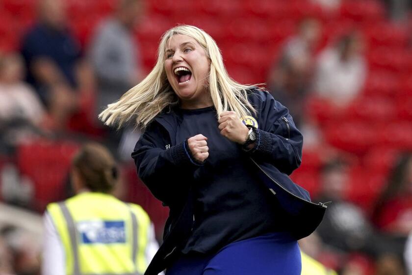 Chelsea manager Emma Hayes celebrates after Mayra Ramirez scores their side's fourth goal of the game, during the English Women's Super League soccer match between Manchester United and Chelsea at Old Trafford, in Manchester, England, Saturday May 18, 2024. (Martin Rickett/PA via AP)