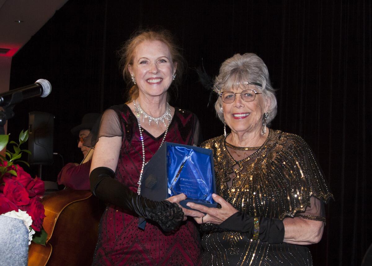 Eileen Cirillio accepts the guild's Inspiration Award at the "All That Jazz" casino night.