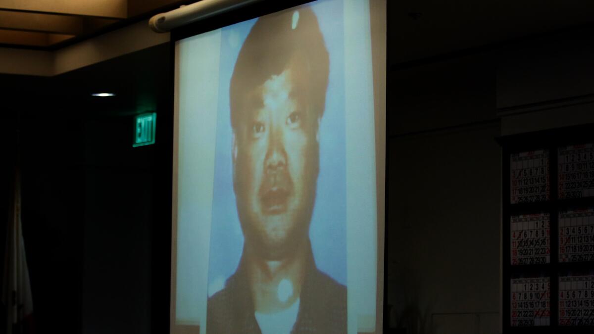 A photo of Yeon Woo Lee is shown in a Santa Ana courtroom this month. Beong Kwun Cho, Lee's longtime best friend, is accused of first-degree murder in the shooting death of his friend.