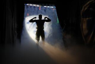 Oregon's Dylan Ennis walks onto the arena floor as he is introduced for the team's NCAA college basketball game against California in the semifinals of the Pac-12 men's tournament Friday, March 10, 2017, in Las Vegas. (AP Photo/John Locher)