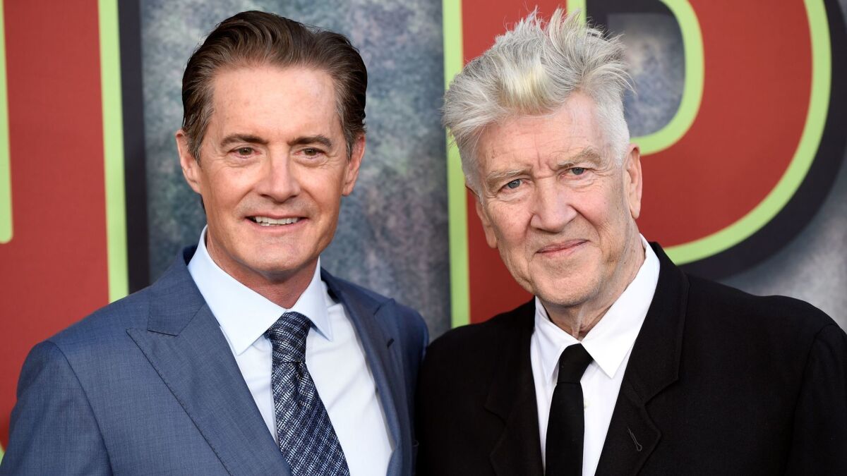 David Lynch, right, the co-creator, director and executive producer of "Twin Peaks," poses with star Kyle MacLachlan at the premiere of the Showtime series at the Theatre at Ace Hotel in Los Angeles.