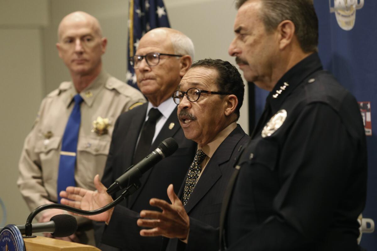 Los Angeles officials speak about protests in the city after the grand jury decision in Ferguson, Mo. From left, Greg Hammond, California Highway Patrol captain; Steve Soboroff, president of Los Angeles Police Commission; Herb Wesson, city council president; and Charlie Beck, LAPD chief.
