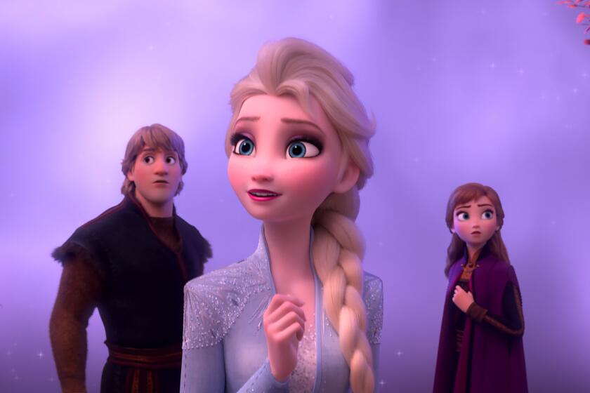 A scene from Disney's "Frozen 2" shows Kristoff, left, Elsa, center, and Anna in front of a light purple background