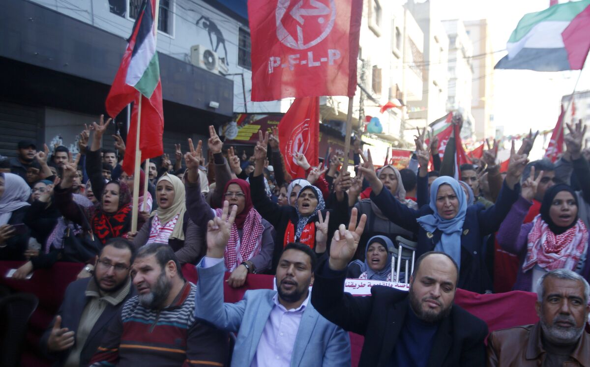 FILE - Palestinians participate in a rally marking the 52nd anniversary of the leftist Popular Front for the Liberation of Palestine (PFLP), in Gaza City, Saturday, Dec. 7, 2019. A Spanish woman on Wednesday, Nov. 10, 2021, admitted to raising large sums of money that were diverted to the banned Palestinian militant group under a plea bargain reached in an Israeli military court. But the verdict did not implicate her in any militant activities for the Popular Front for the Liberation of Palestine. (AP Photo/Hatem Moussa, File)