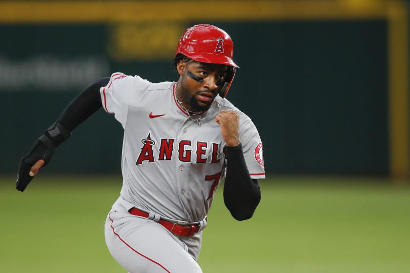 Los Angeles Angels' Jo Adell (7) runs to third during a baseball game against the Texas Rangers