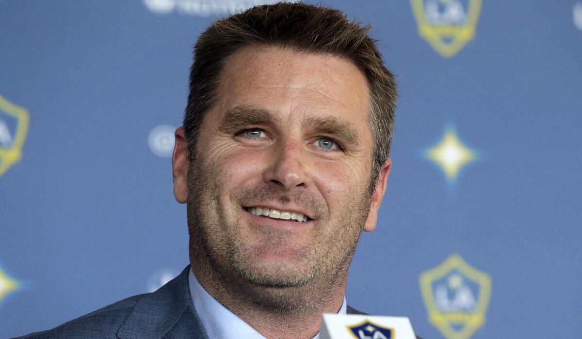 Curt Onalfo smiles as he is introduced as coach of the Galaxy at a news conference in Carson.