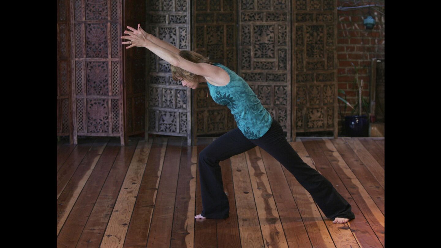The body is in a modified lunge position, with the front leg bent and the back leg straight. Arms are straight and parallel, reaching upward, palms together. Don't: Push the knee too far over the ankle. When the knee goes too far forward, the knee joint is in a precarious position. This puts strain on the kneecap and the knee joint, possibly causing pain. It's like building a structure  you don't want to have boards on an angle, you want to have a square foundation.