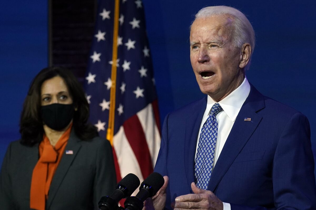 President-elect Joe Biden, joined by Vice President-elect Kamala Harris, speaks at The Queen theater, Monday, Nov. 9, 2020, in Wilmington, Del. (AP Photo/Carolyn Kaster)