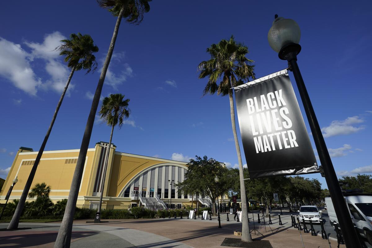 A Black Lives Matter banner hangs outside the arena in Florida where the Milwaukee Bucks refused to take the court Wednesday.