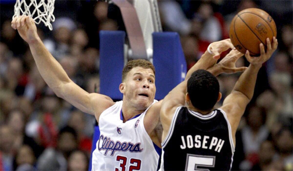Blake Griffin is called for a foul on San Antonio's Corey Joseph during the third quarter of the Clippers win over the Spurs, 115-92, on Monday at Staples Center.
