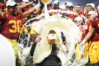 San Diego, CA - December 27: USC players dump eggnog on head coach Lincoln Riley after the Trojans beat Louisville during the Holiday Bowl at Petco Park on Wednesday, Dec. 27, 2023 in San Diego, CA. (Meg McLaughlin / The San Diego Union-Tribune)